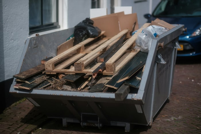 Skip filled with wood and construction debris